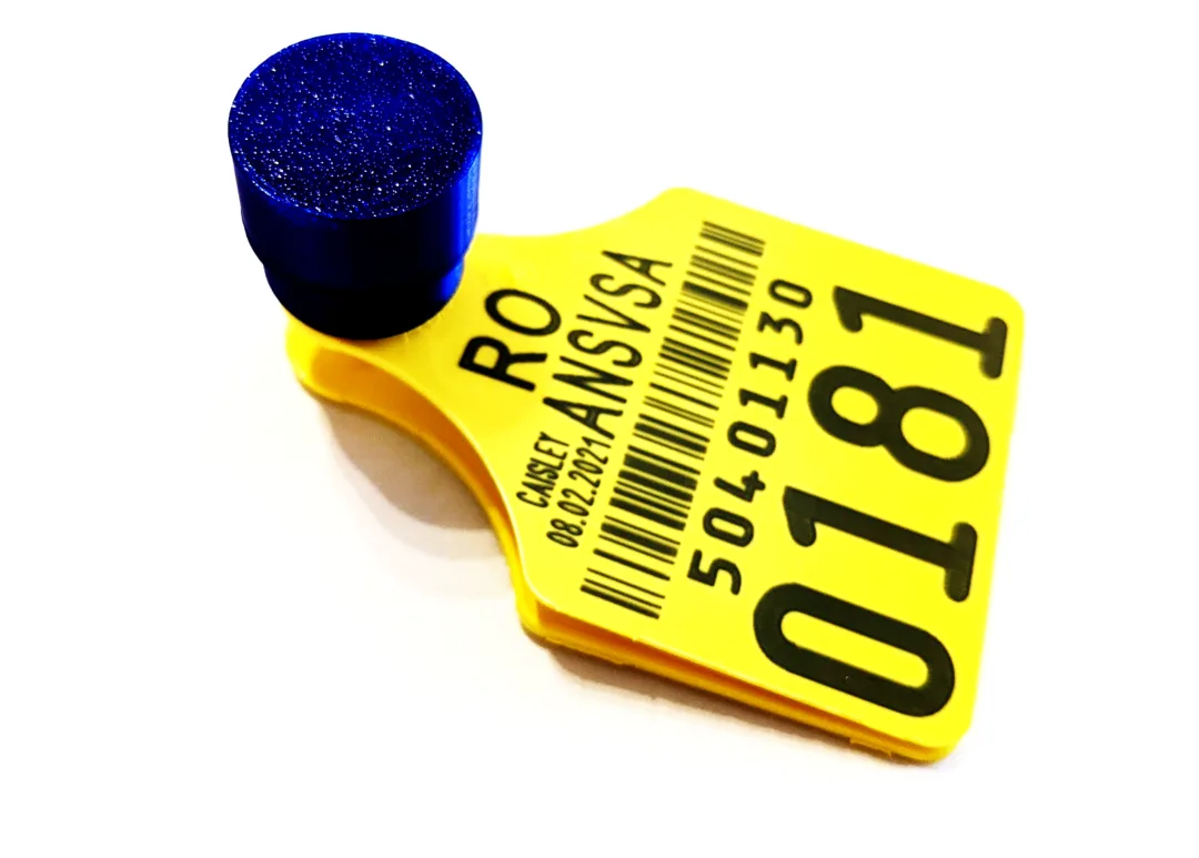 Assembled blue tag fitted on a yellow cattle ear tag